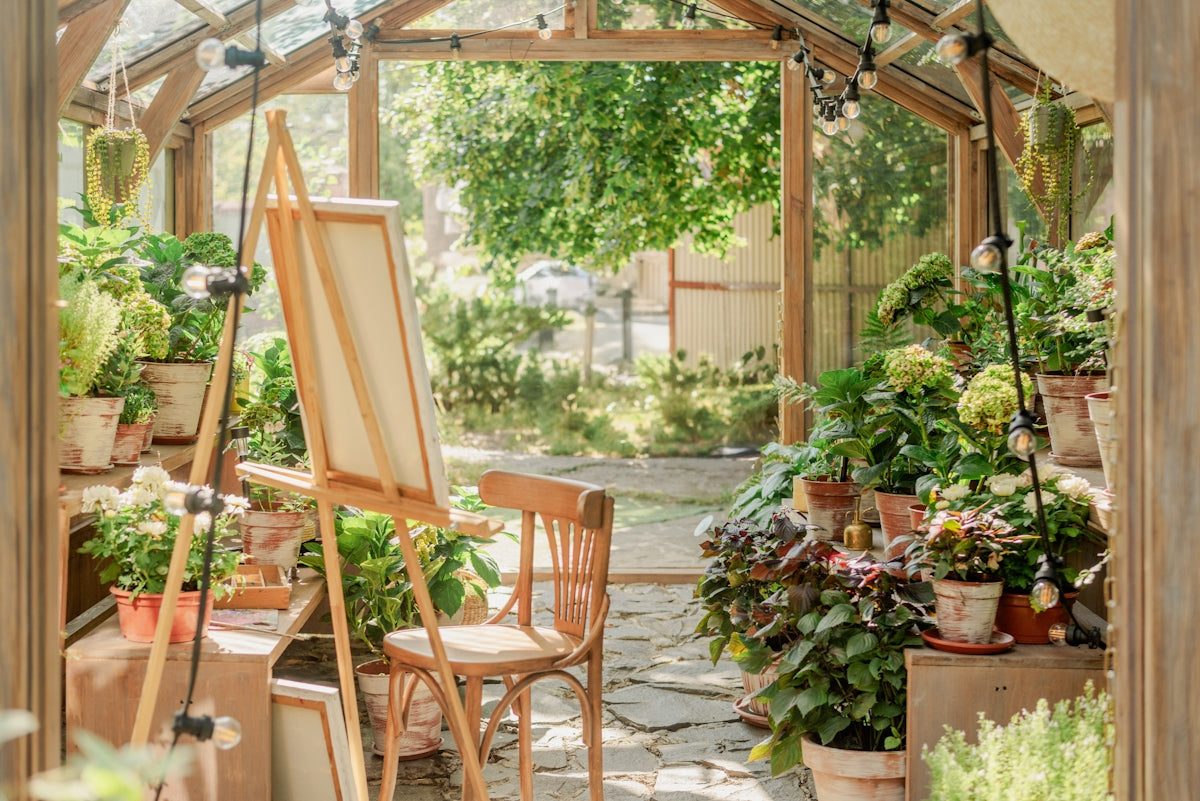 A garden filled with lots of potted plants