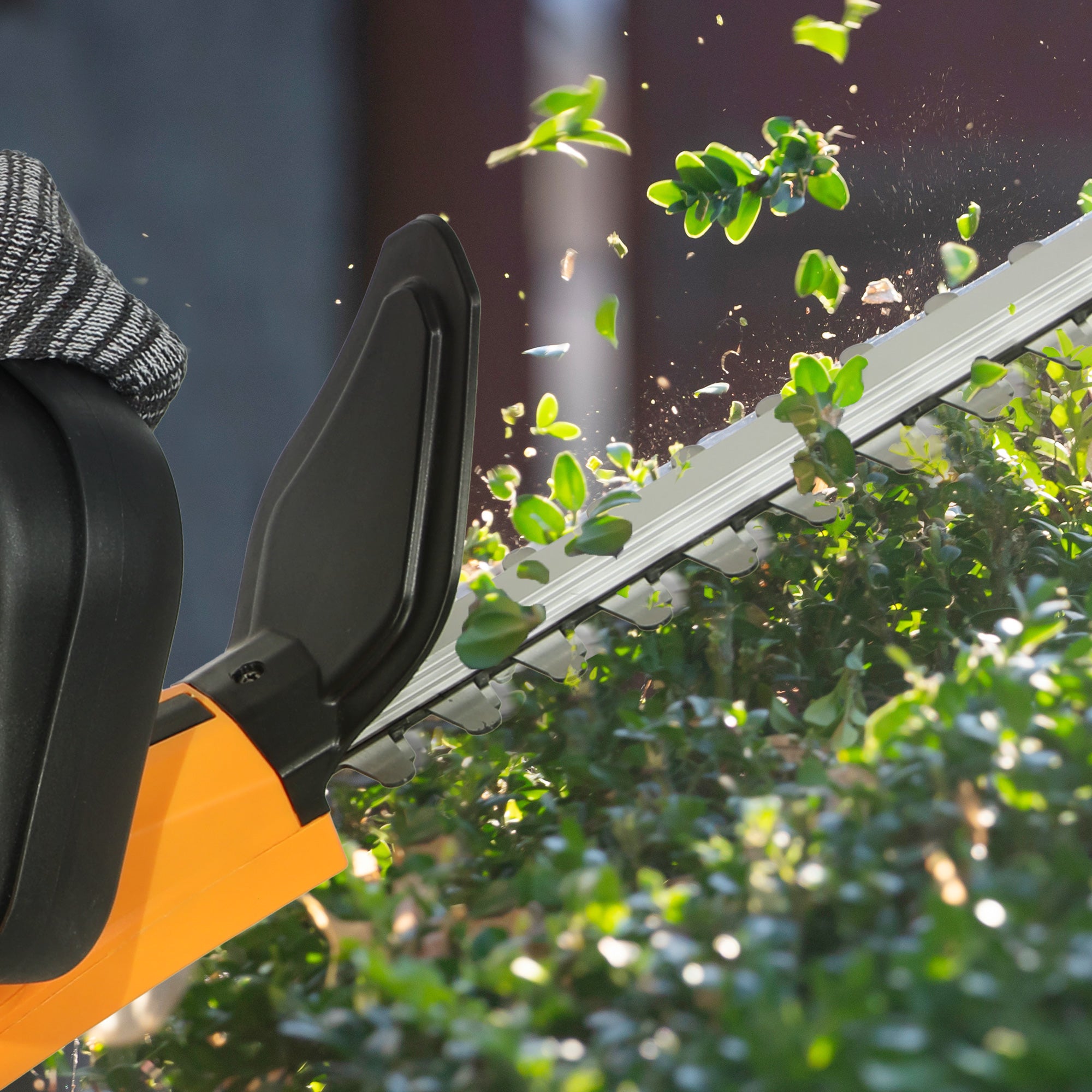 Outsunny Cordless Hedge Trimmer, Electric Hedge Cutter with 51cm Blade, Brushless Motor and 2 x 4.0Ah Batteries for Branches, Shrubs, Twigs, Orange - North Peak Garden Furniture