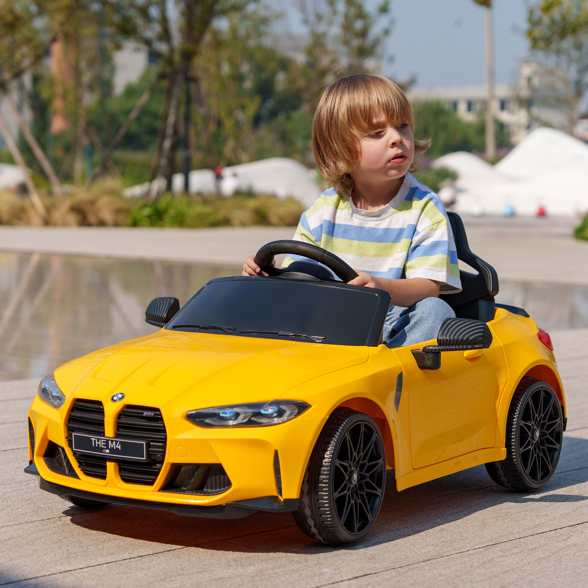 AIYAPLAY 12V BMW M4 Licensed Kids Car with Easy Transport, Remote Control, Suspension, Music, Horn, LED Lights, Yellow