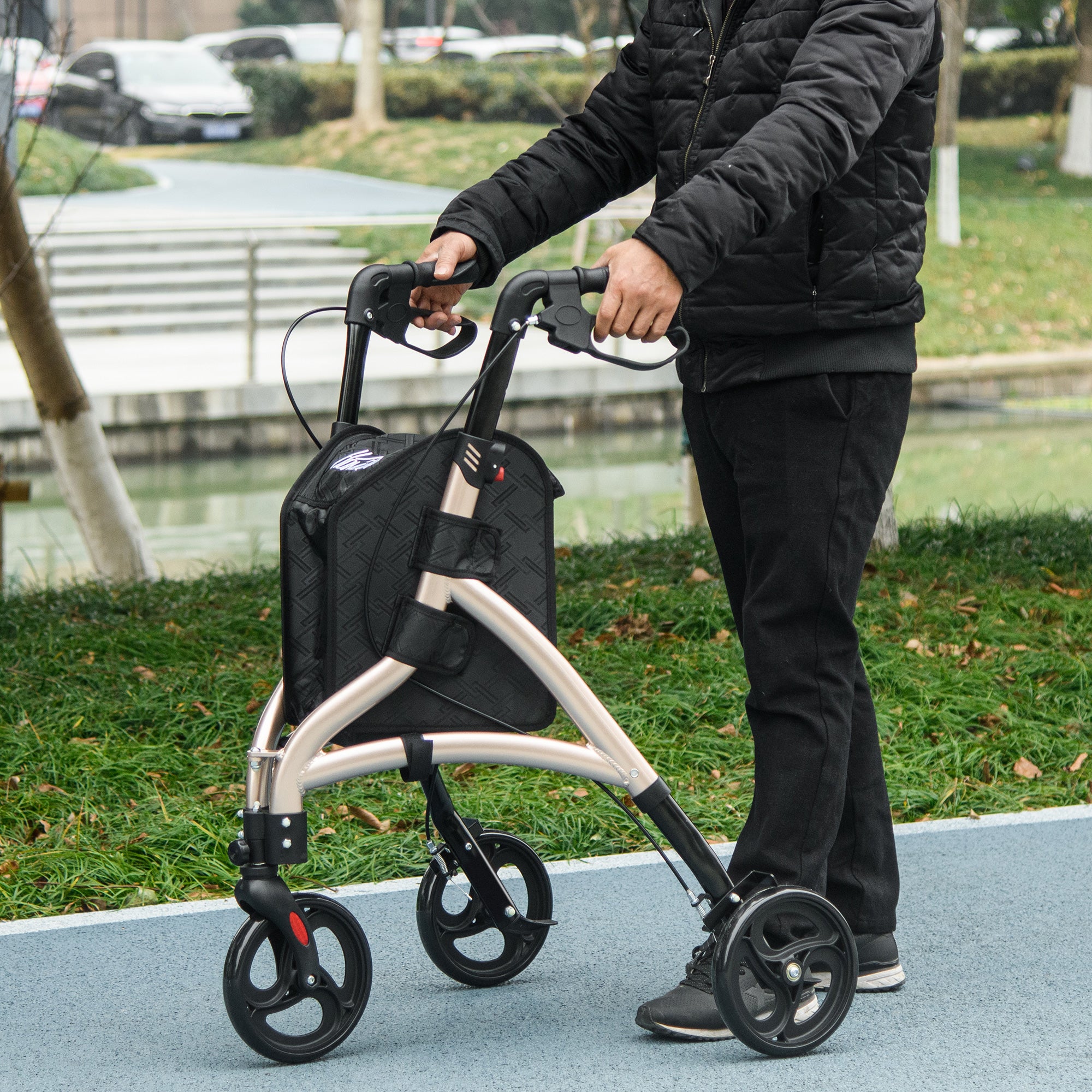 HOMCOM 3 Wheel Rollator, Lightweight Aluminium Tri Walker with Adjustable Handle, Storage Bag and Dual Brakes, Folding Mobility Walking Aid for Elderly, Handicapped, 5.3kg, Gold Tone - North Peak Garden Furniture